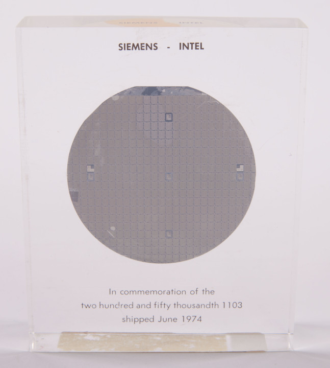 This wafer of 1103 DRAM chips in acrylic commemorated the 1103's achievement. 