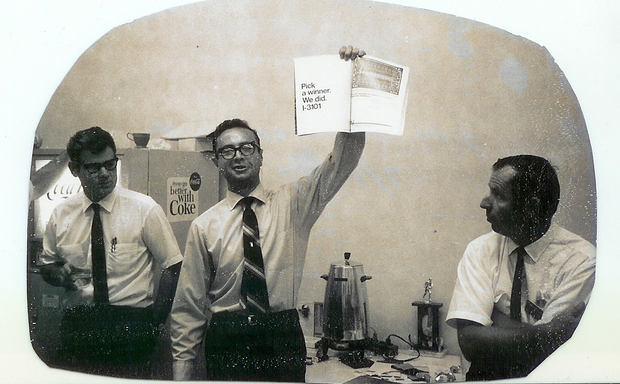 Future CEO Andy Grove holding up an advertisement for the 3101. 