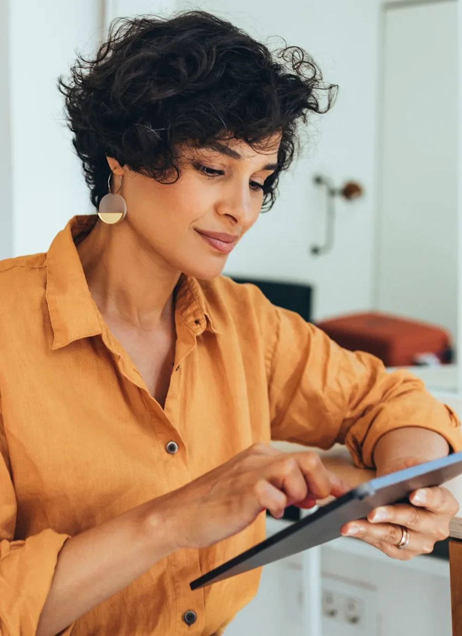 A person interacting with their tablet.