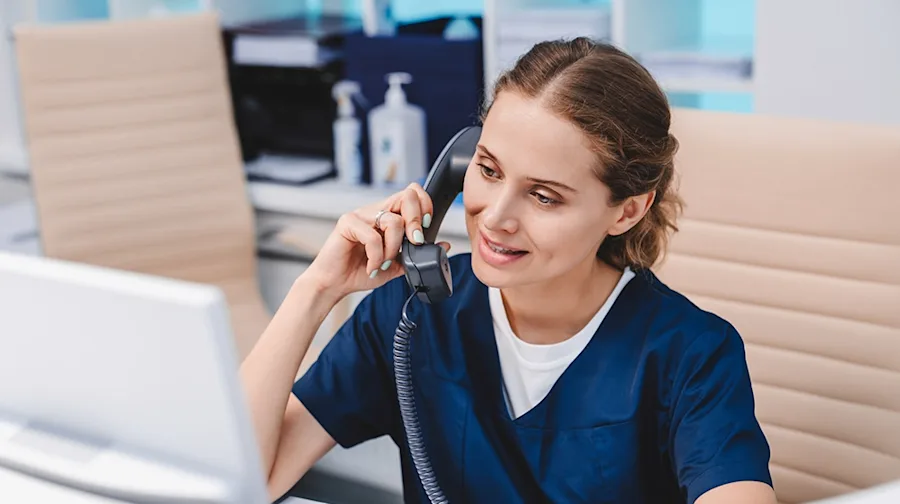 A medical professional on a phone call.