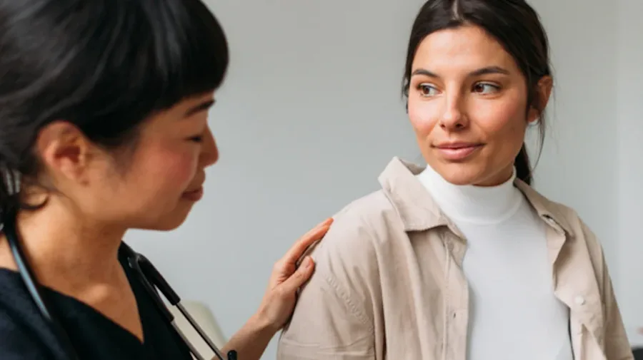 A person interacting with a medical professional.