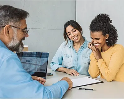 Two women consulting with an advisor.