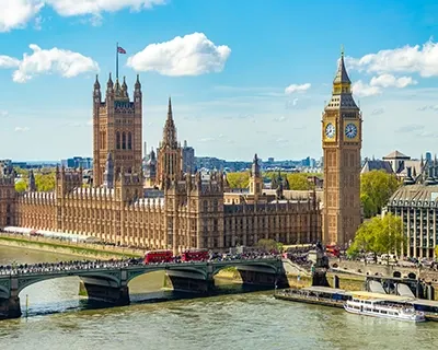A view of a city with large buildings and a clocktower.