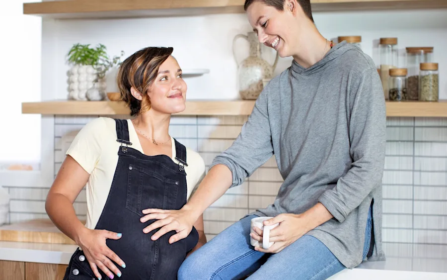 Couple admiring their pregnancy belly.