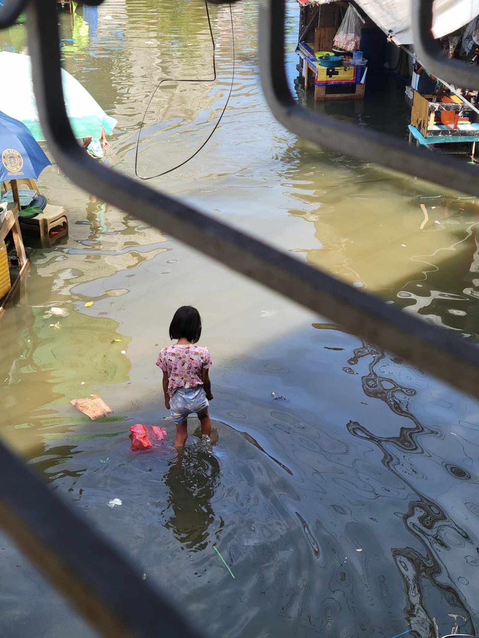 Our childeren have to walk through flood water
