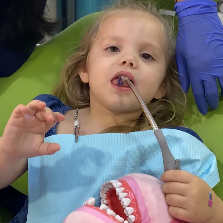 Dr. Faredha treating a young patient