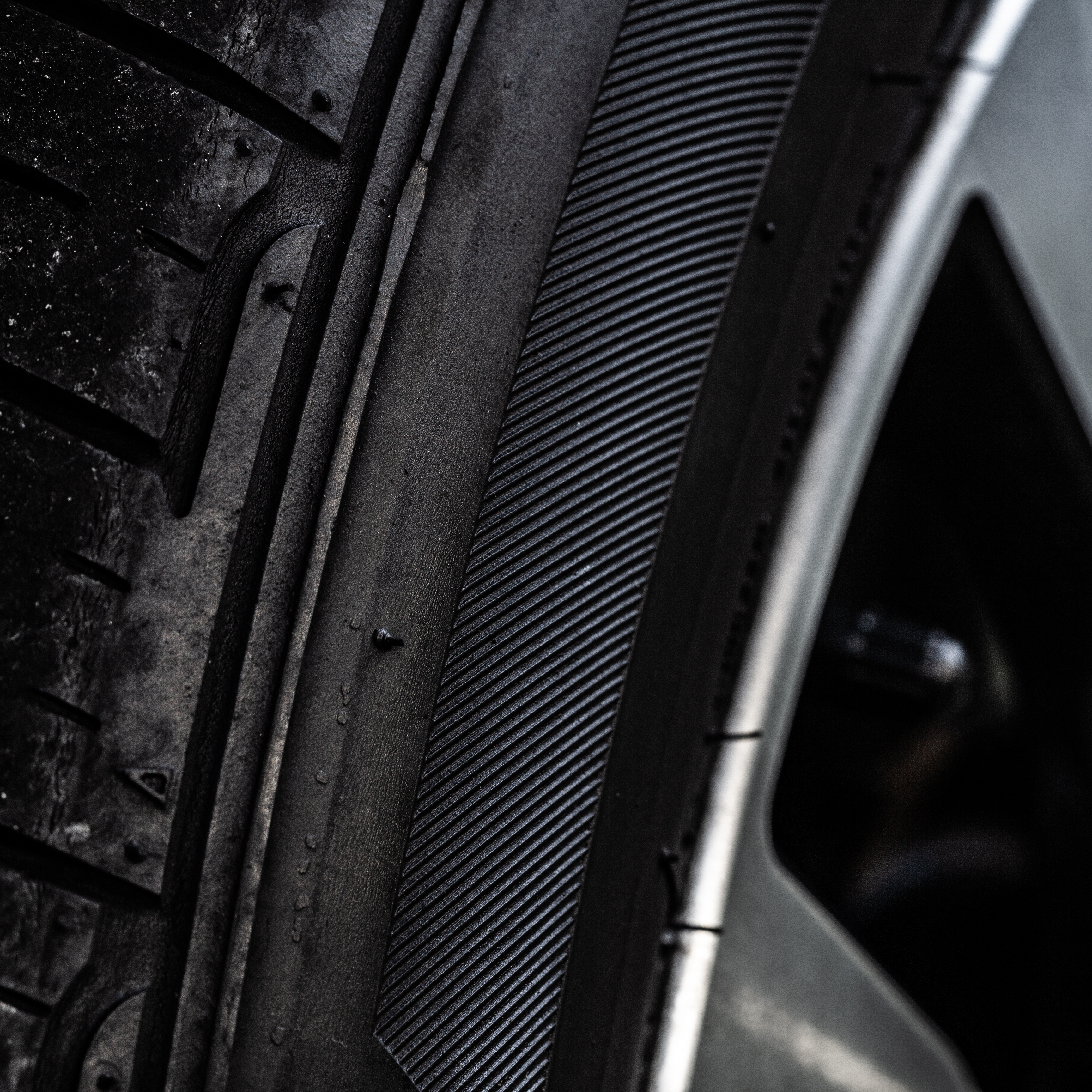 A close up photograph of a tire.