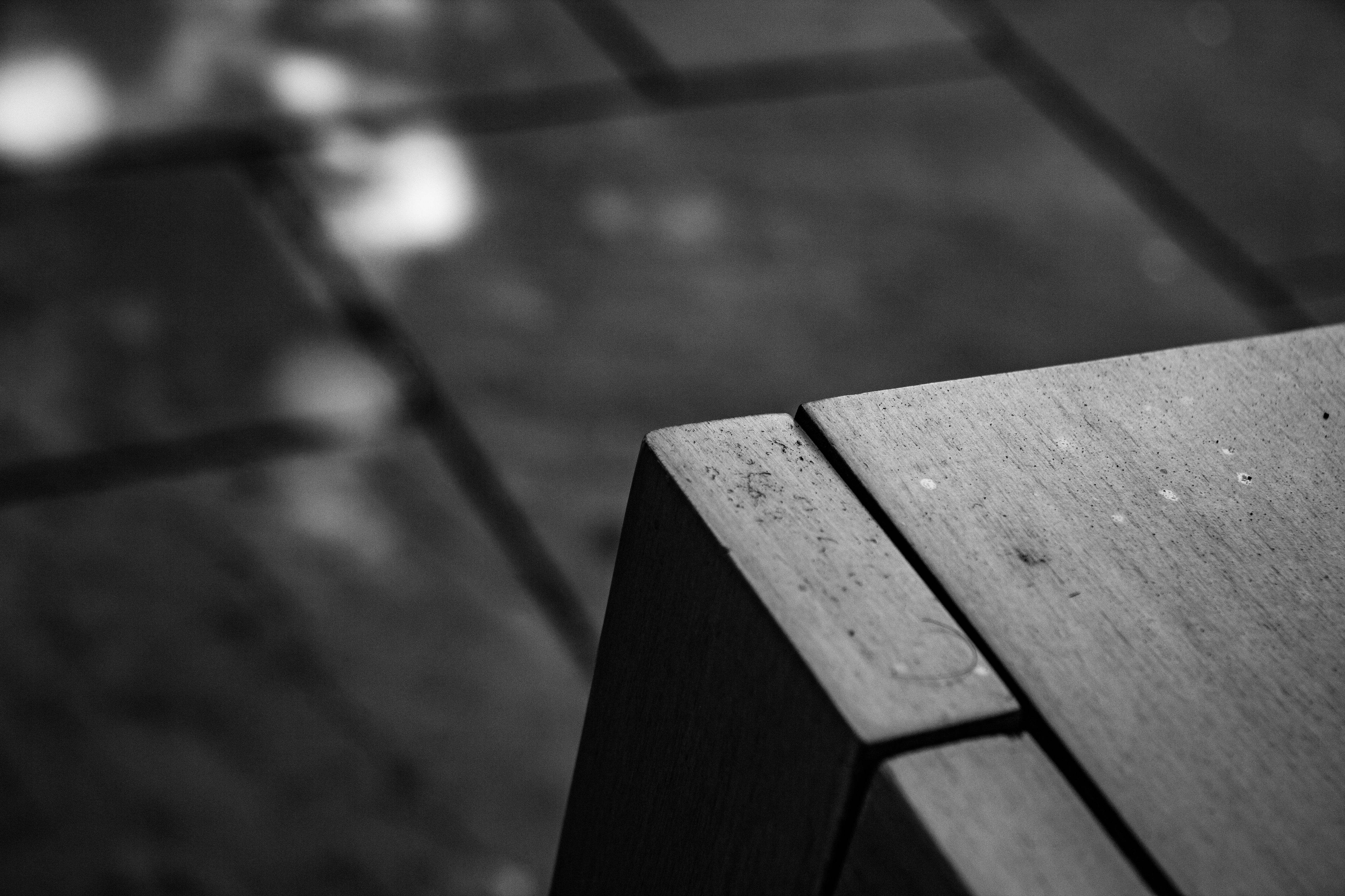 A photograph of a bench corner.