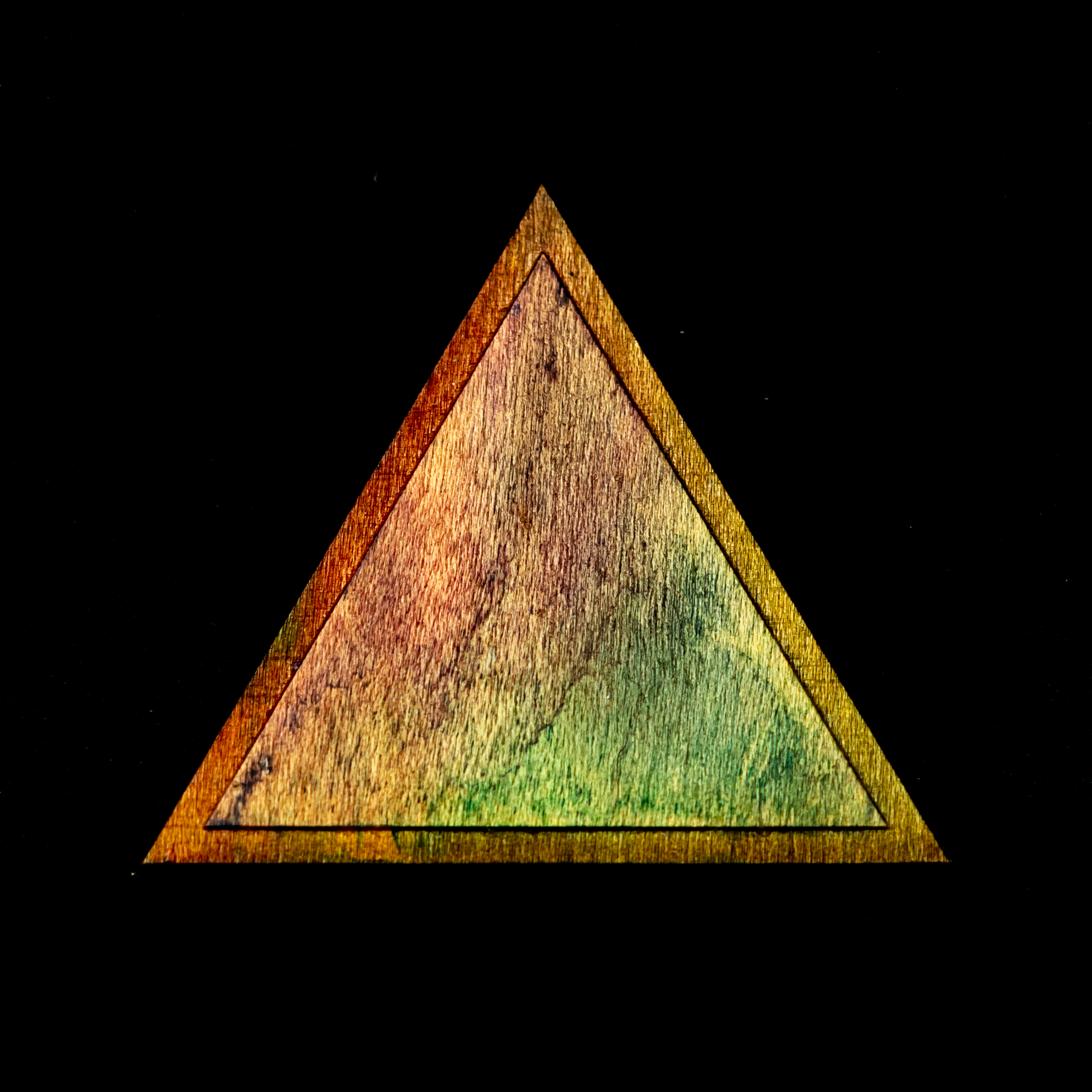 A photograph of a wooden triangle.