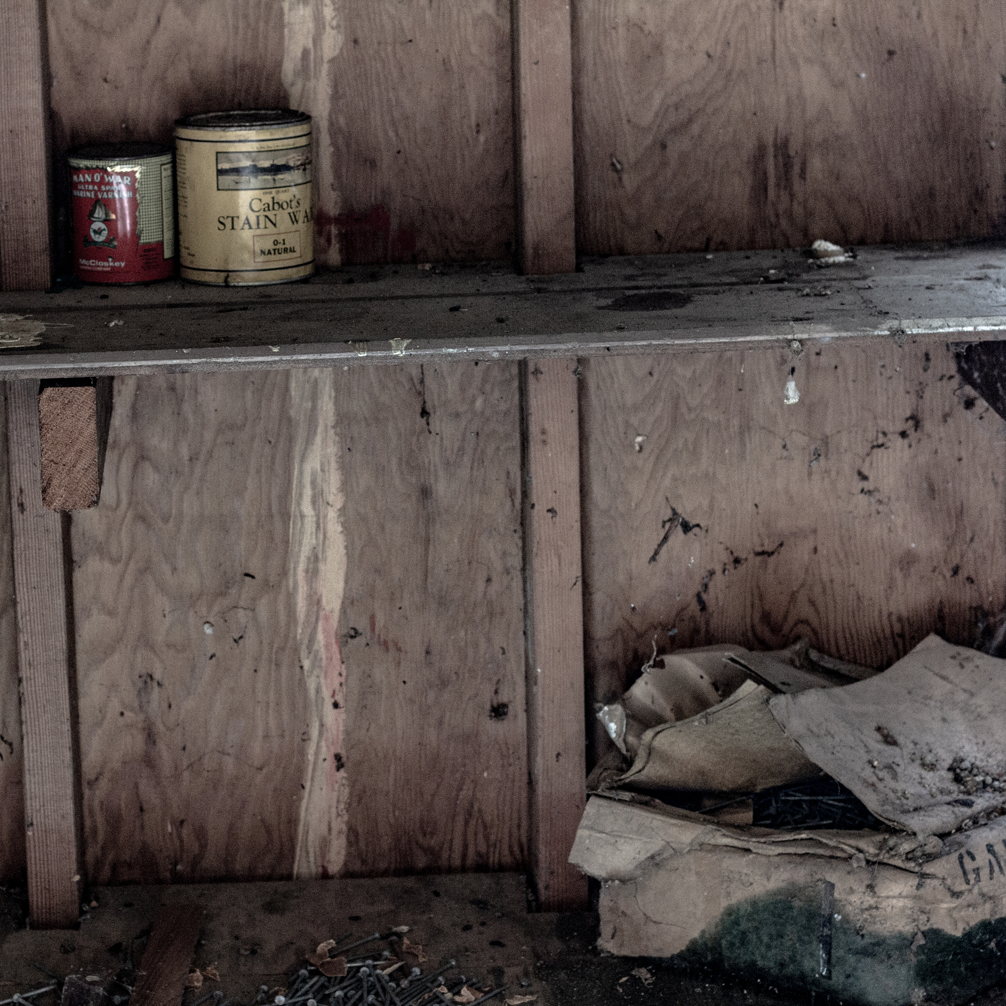 A photograph of some detritus left behind in a storage shed.