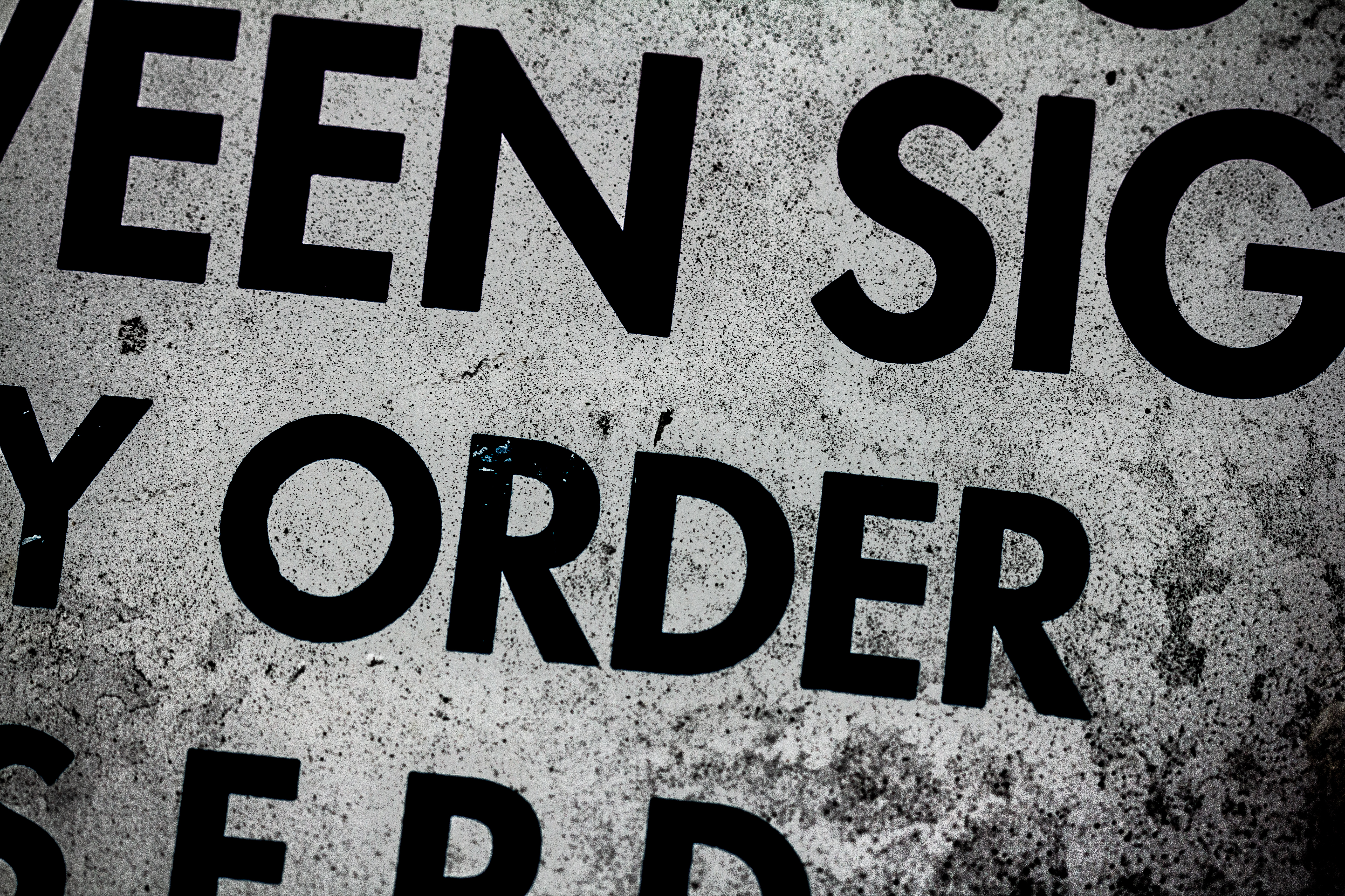 A photograph of the word "order" on a sign.