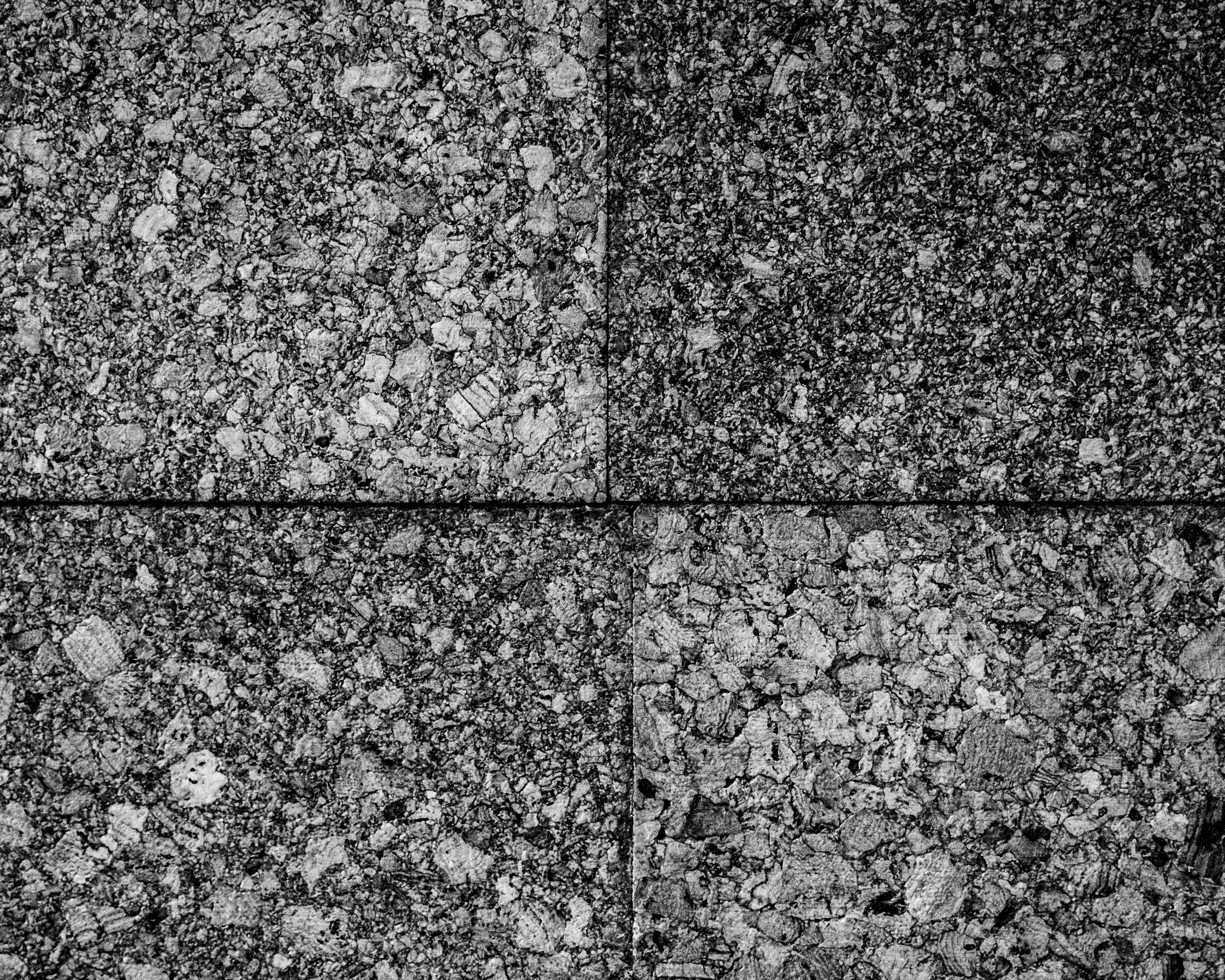 A photograph of some cork boards aranged into quadrants.