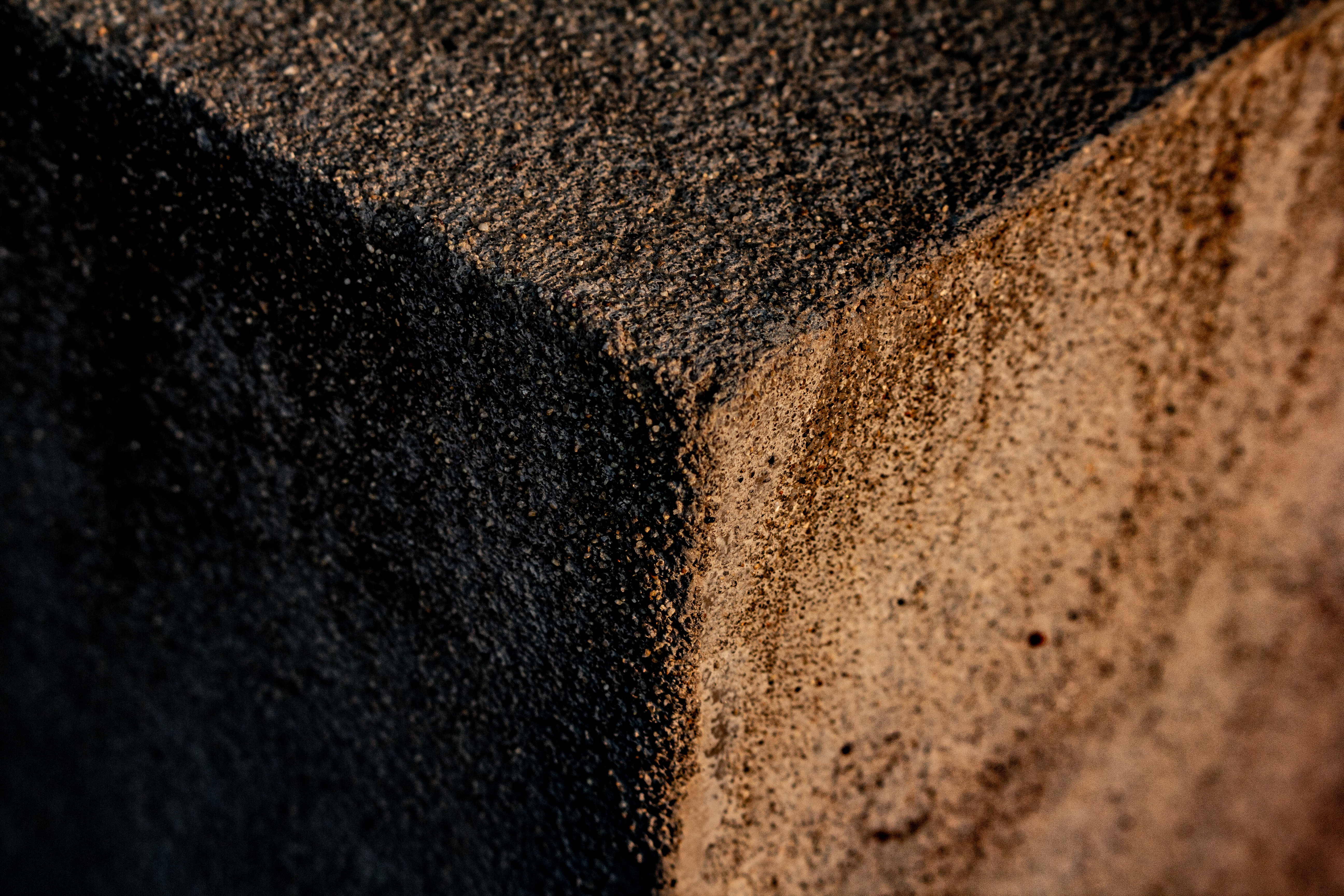 A photograph of a Y shaped edge of a concrete block.