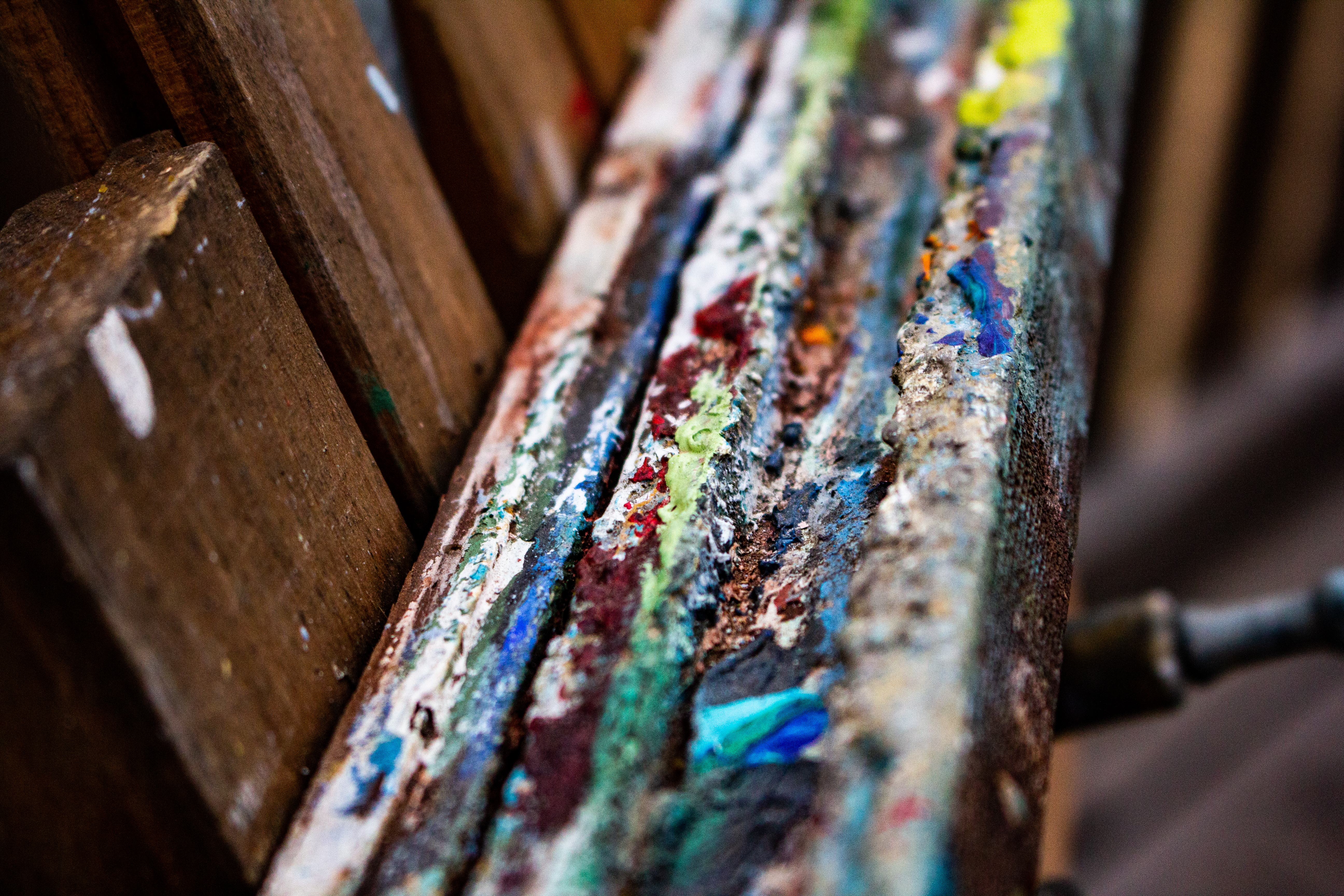 A photograph of the art that forms at the bottom of an easel's cross-bar.