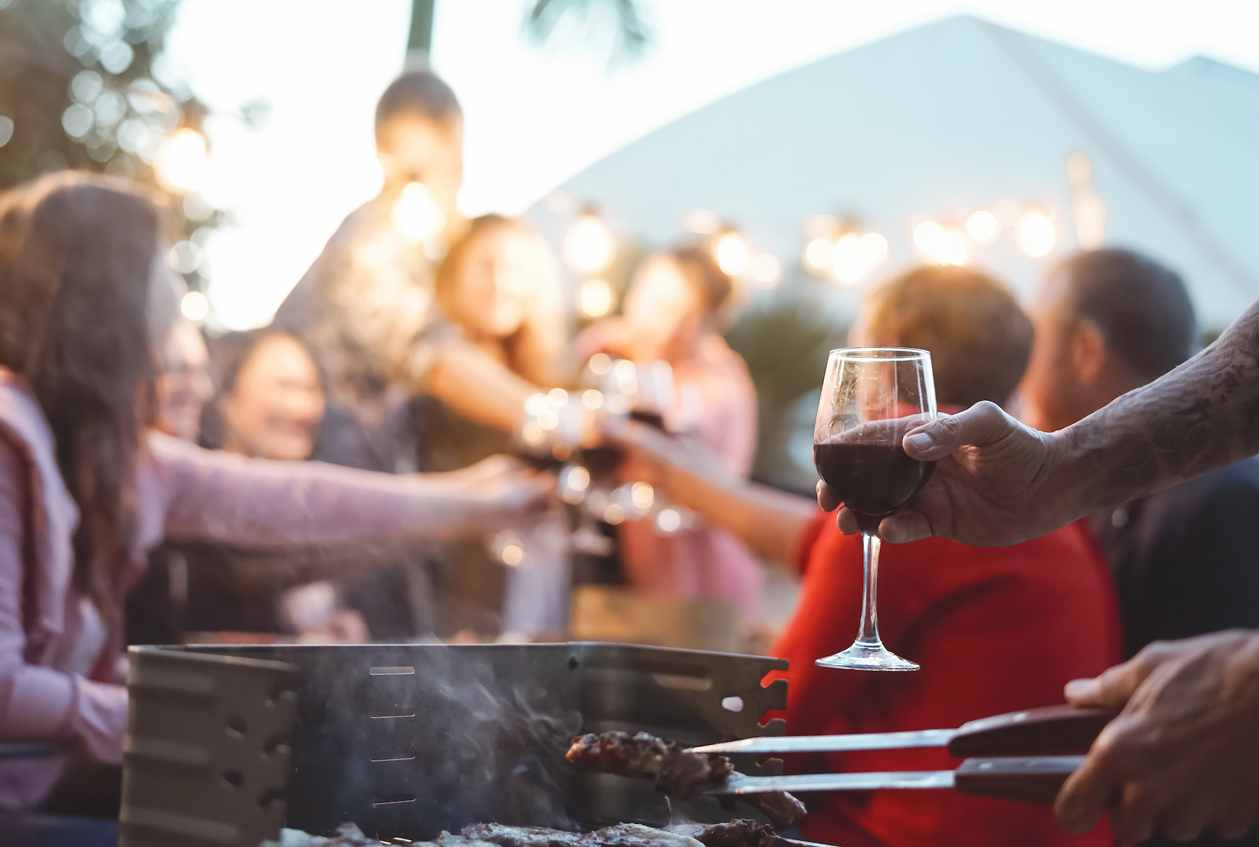 Happy-family-doing-celebratory-toast-at-barbecue-party---Young-and-older--parents-having-fun-dining-together-in-garden---Dinner-bbq-food-and-youth-elderly-generation-activities-concept-1189533428 3469x2334