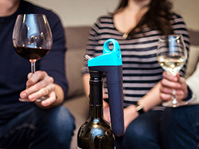Pivot system on bottle in gray with a group of people socializing with red and white wine in the background.