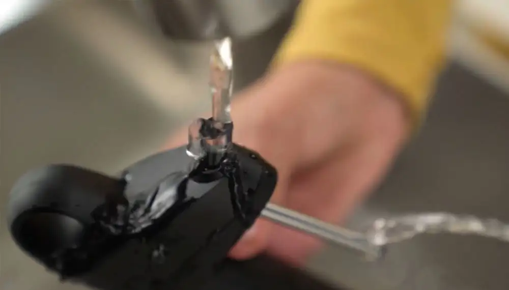 Stream of water flowing into the spout of the Pivot Wine Preservation System