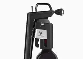 Product shot of a Coravin Wine Preservation System on a wine bottle, with the Coravin Aerator inserted.