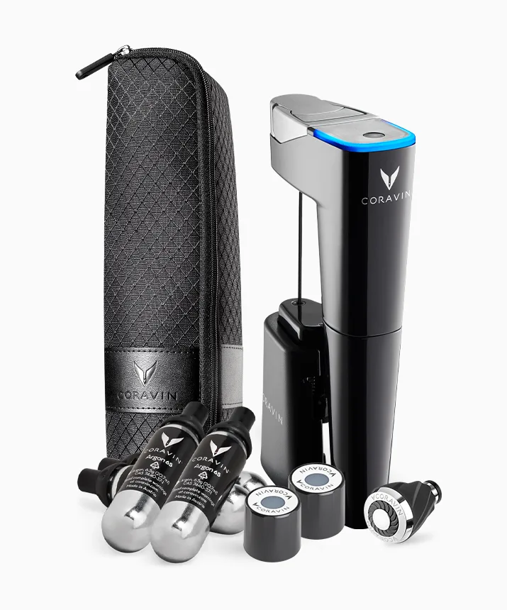 Product shot of a Coravin Model Eleven Wine Preservation System, Coravin Pure Capsules, Coravin Screwcaps, Coravin Aerator, and Coravin Carry Case.