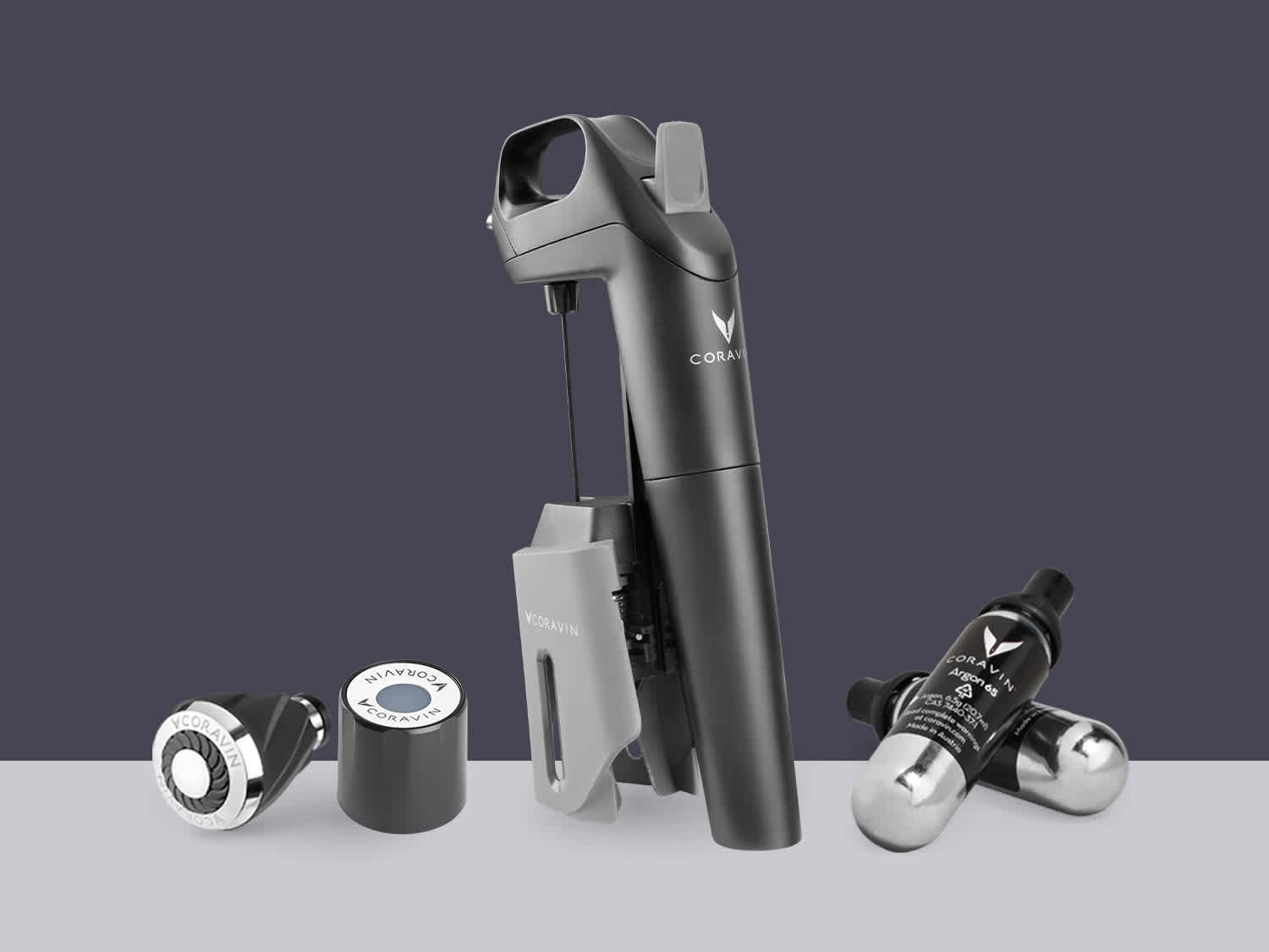 Product shot of Model Three System, two Coravin Capsules, one Coravin Screw Cap, and one Coravin Aerator.