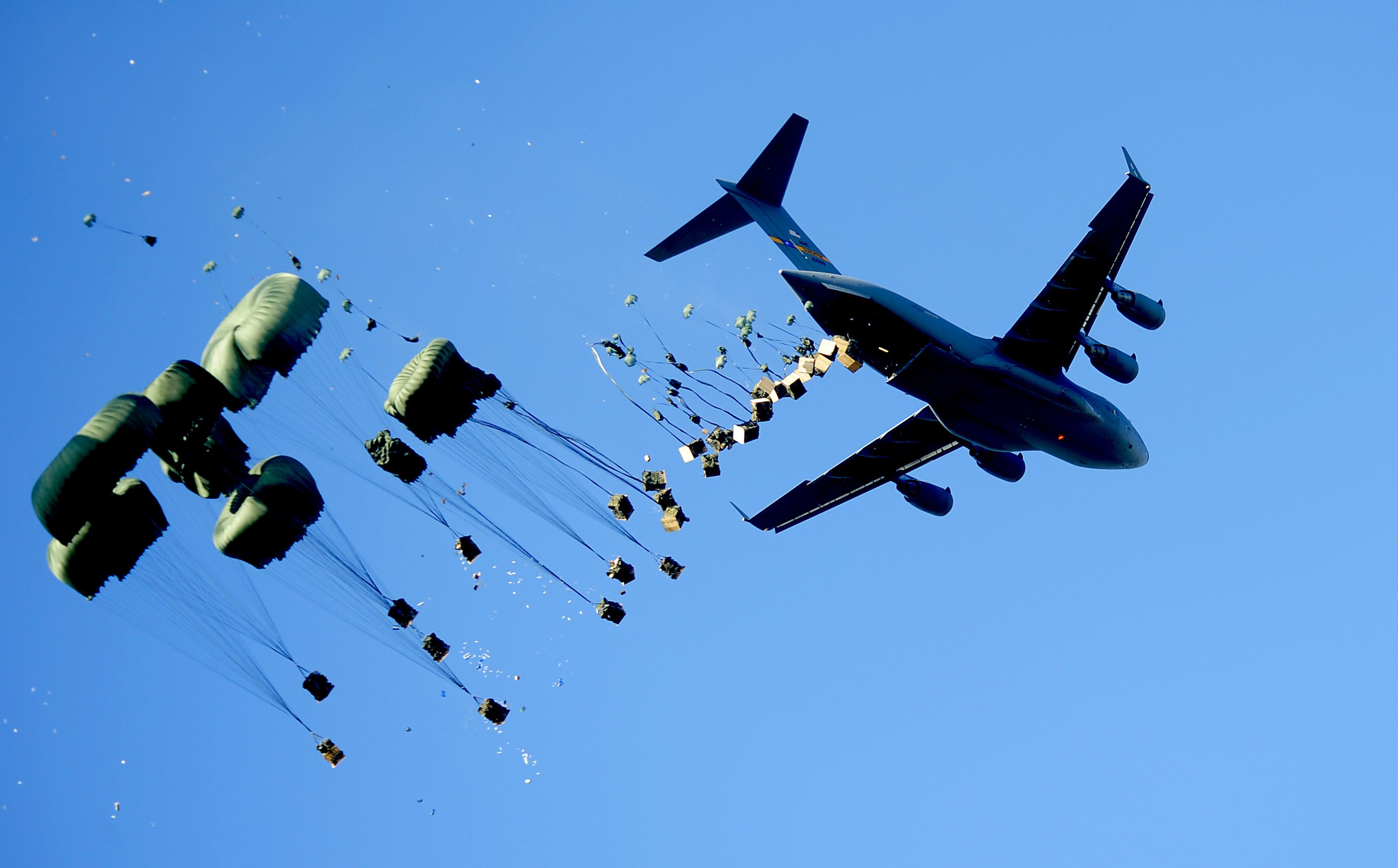 USAF C-17 airdrops supplies for Haiti