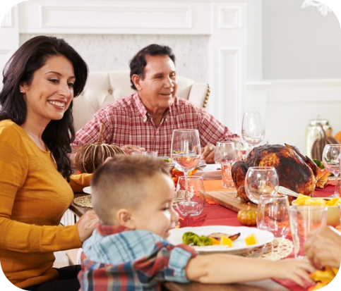 Family Holiday Tradition, family sitting at dinner table