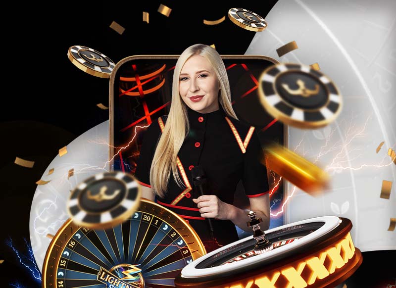 Live casino dealer with roulette wheel and casino chips.