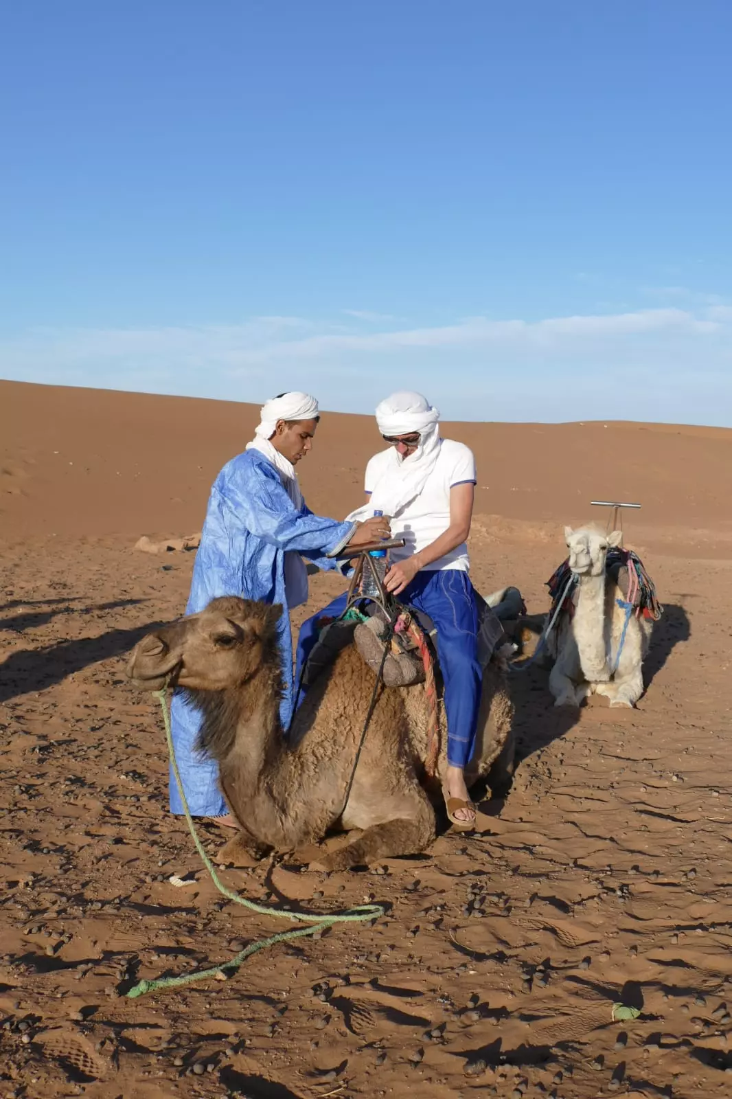 Aziz teaching to ride a camel