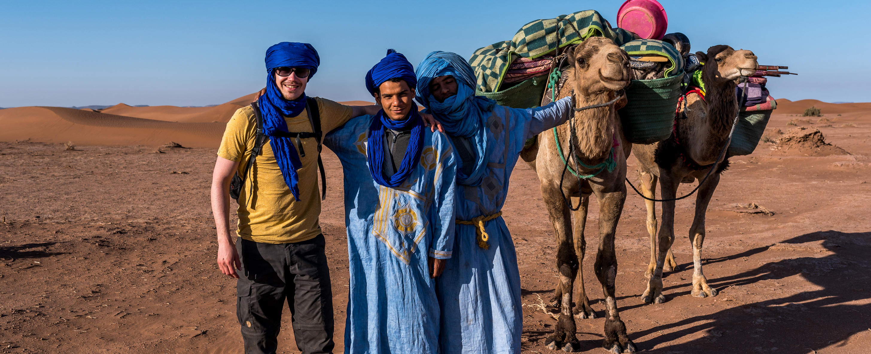 Aziz with friends and camels