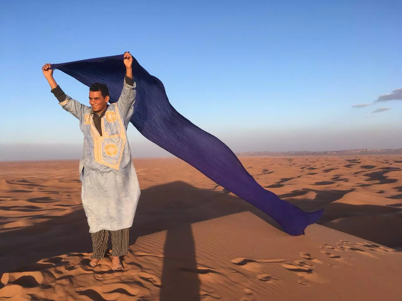 Aziz waving scarf