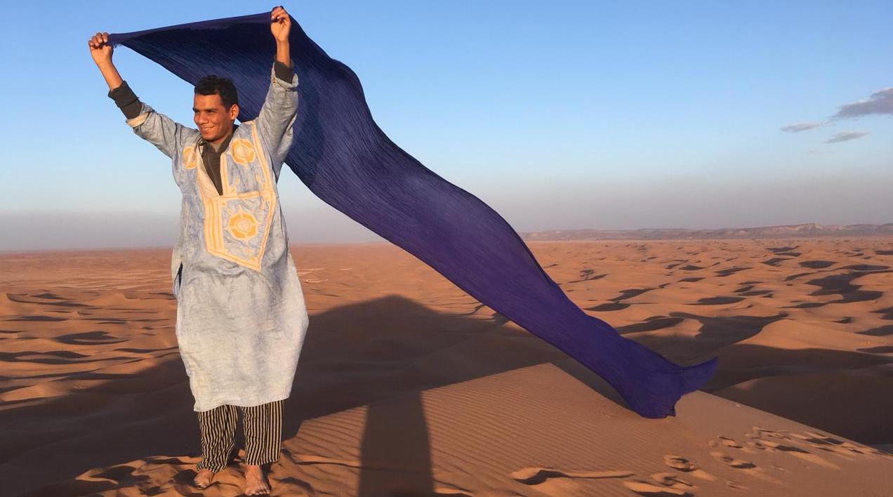 Aziz waving scarf