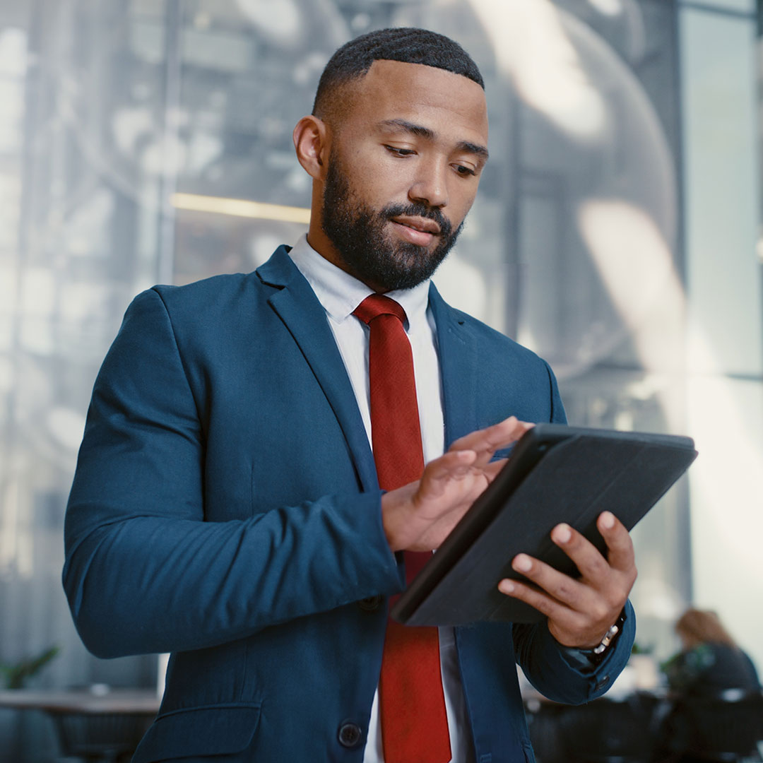 Industries Case Study Man with Tablet