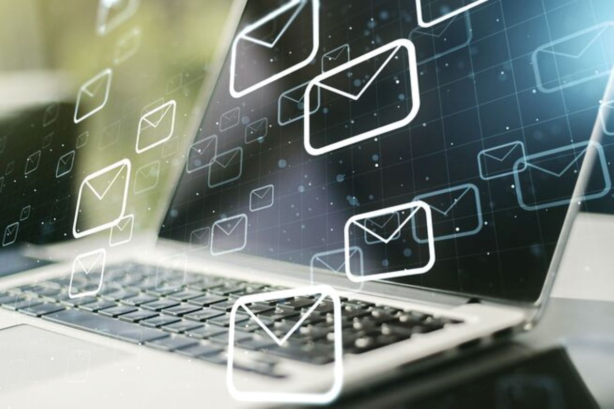 Digital illustration of white envelope icons floating from a laptop screen, representing email communication and messaging.