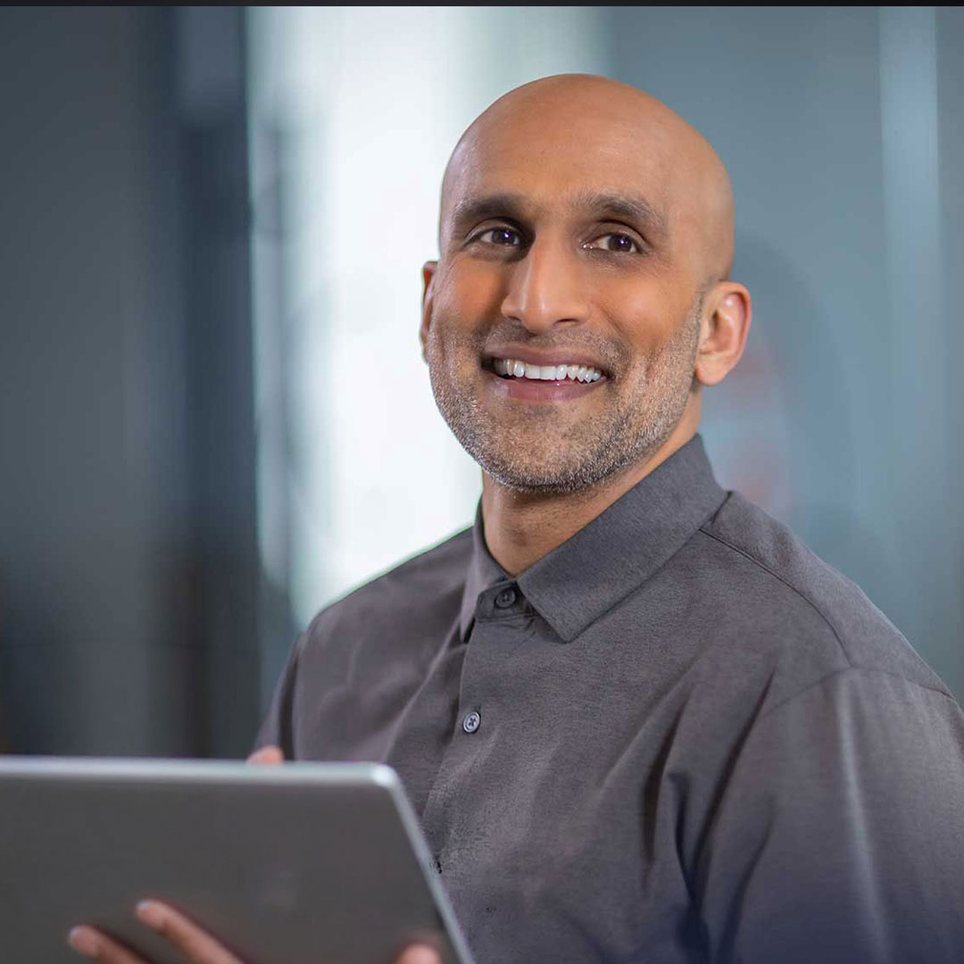 Quadient Man with Tablet
