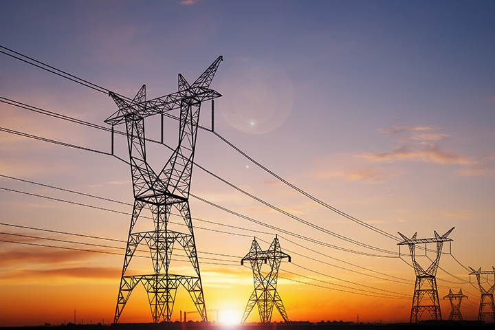 electrical power lines with sunset on the background