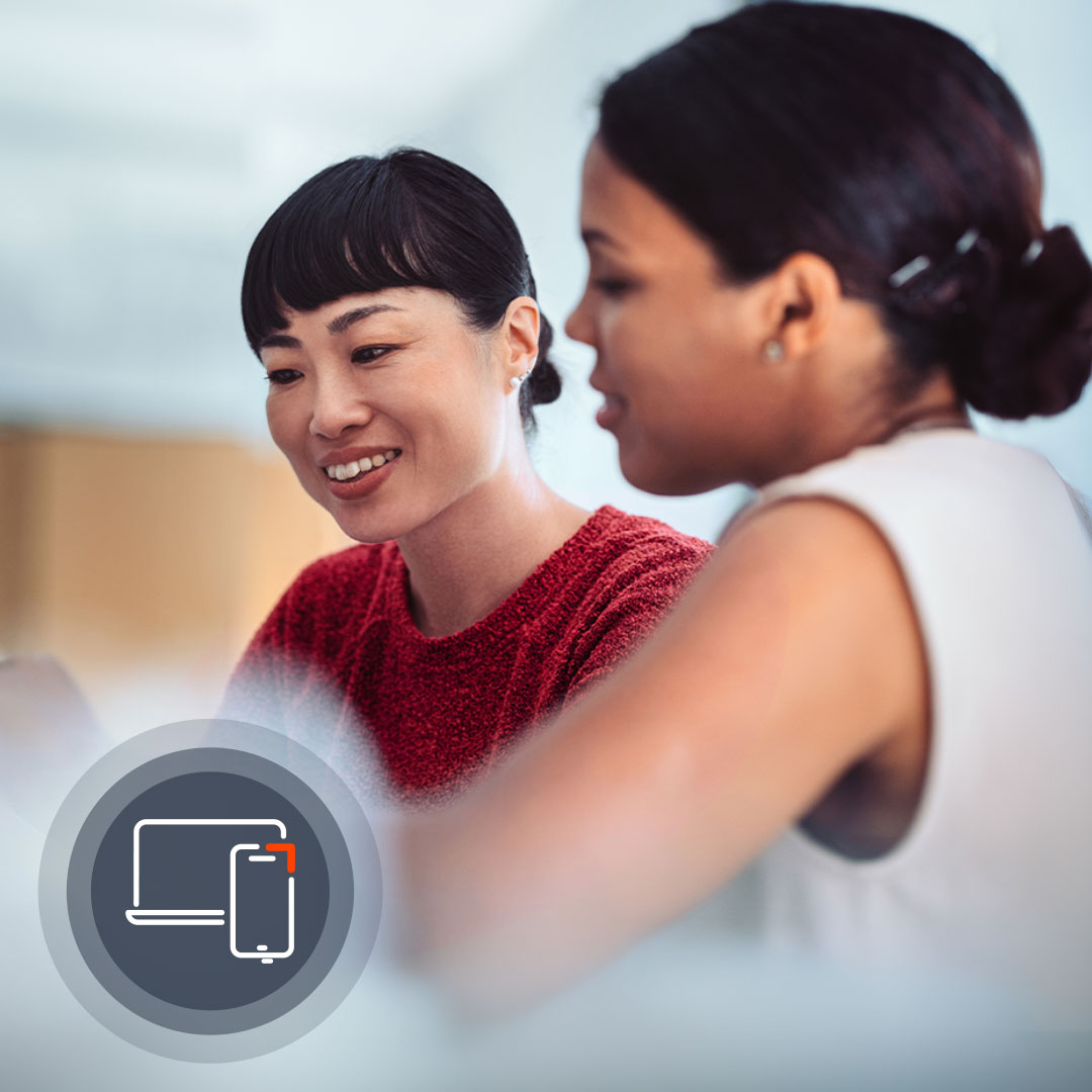 Two women engaged in conversation, one wearing a red textured top smiling at the other in white, with a device icon overlay.