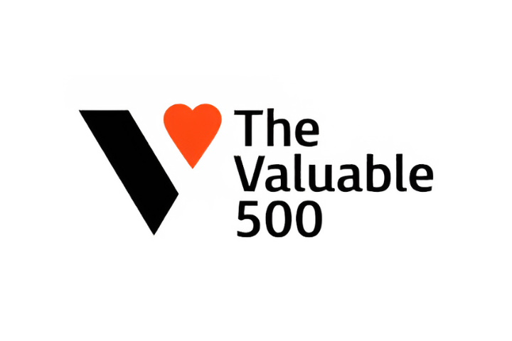 The Valuable 500 logo in black, with an orange heart