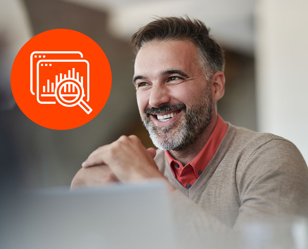 Smiling man in beige sweater with orange data analytics icon showing charts and magnifying glass on left side