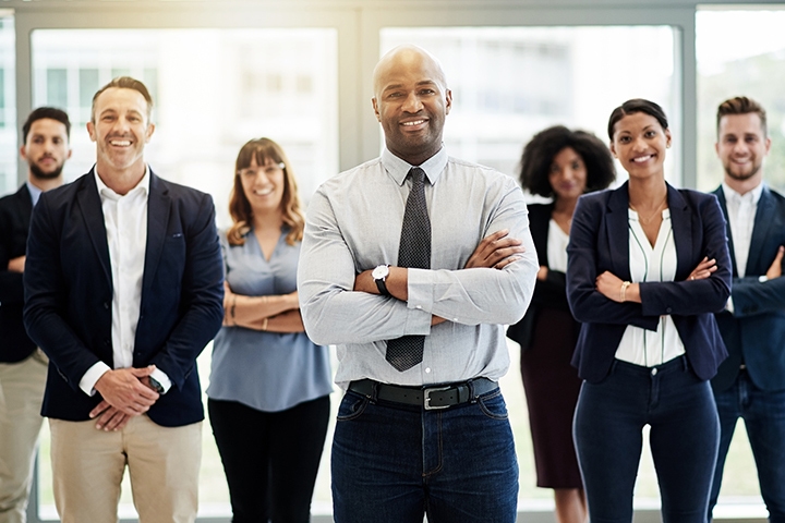business team posing together in a professional setting