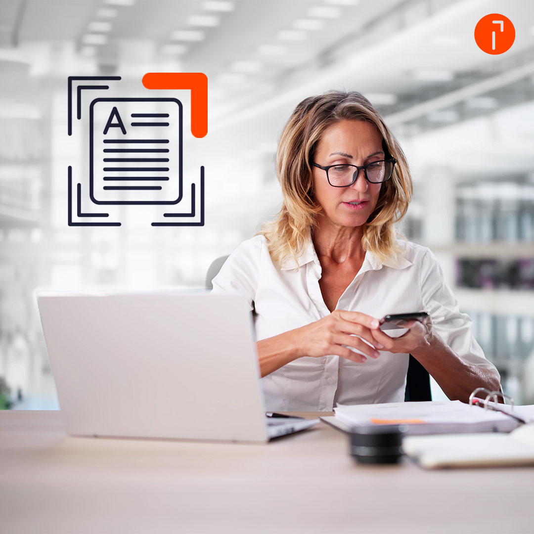 A woman scanning a document with her smartphoneA woman scanning a document with her smartphone
