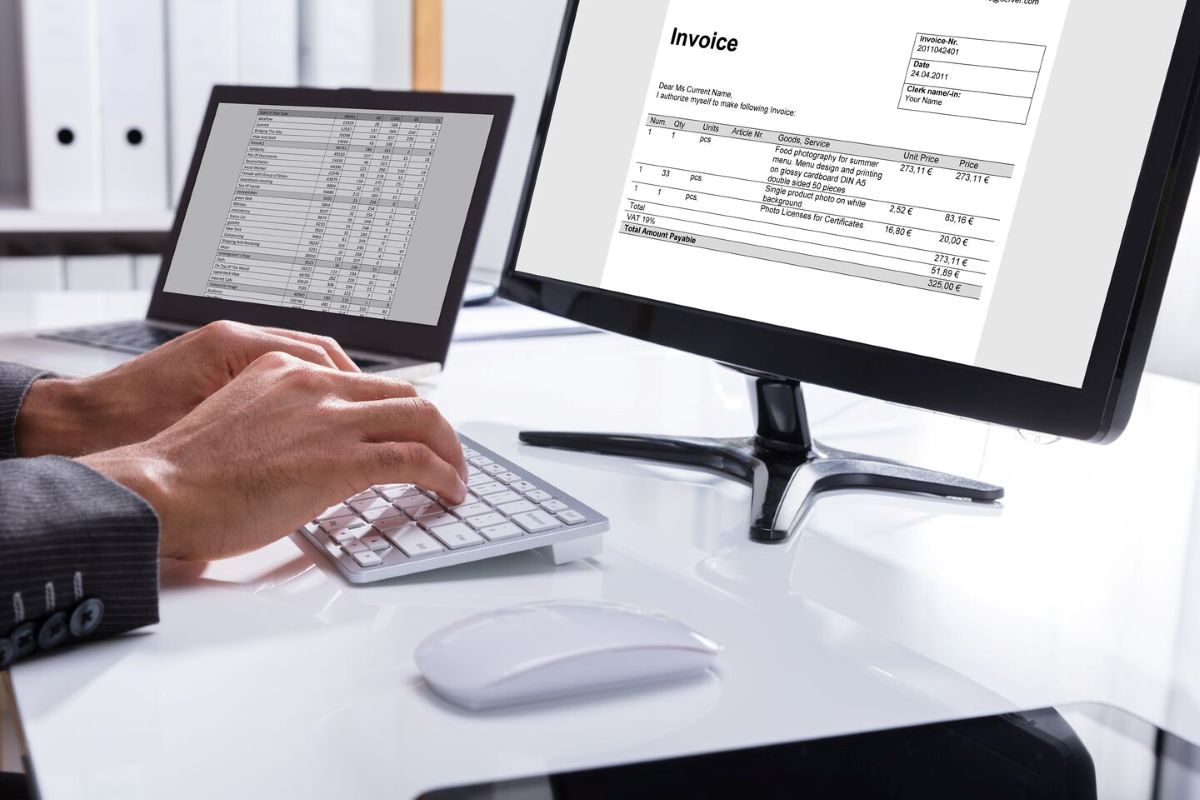 Image of Computer Screen with spreadsheets