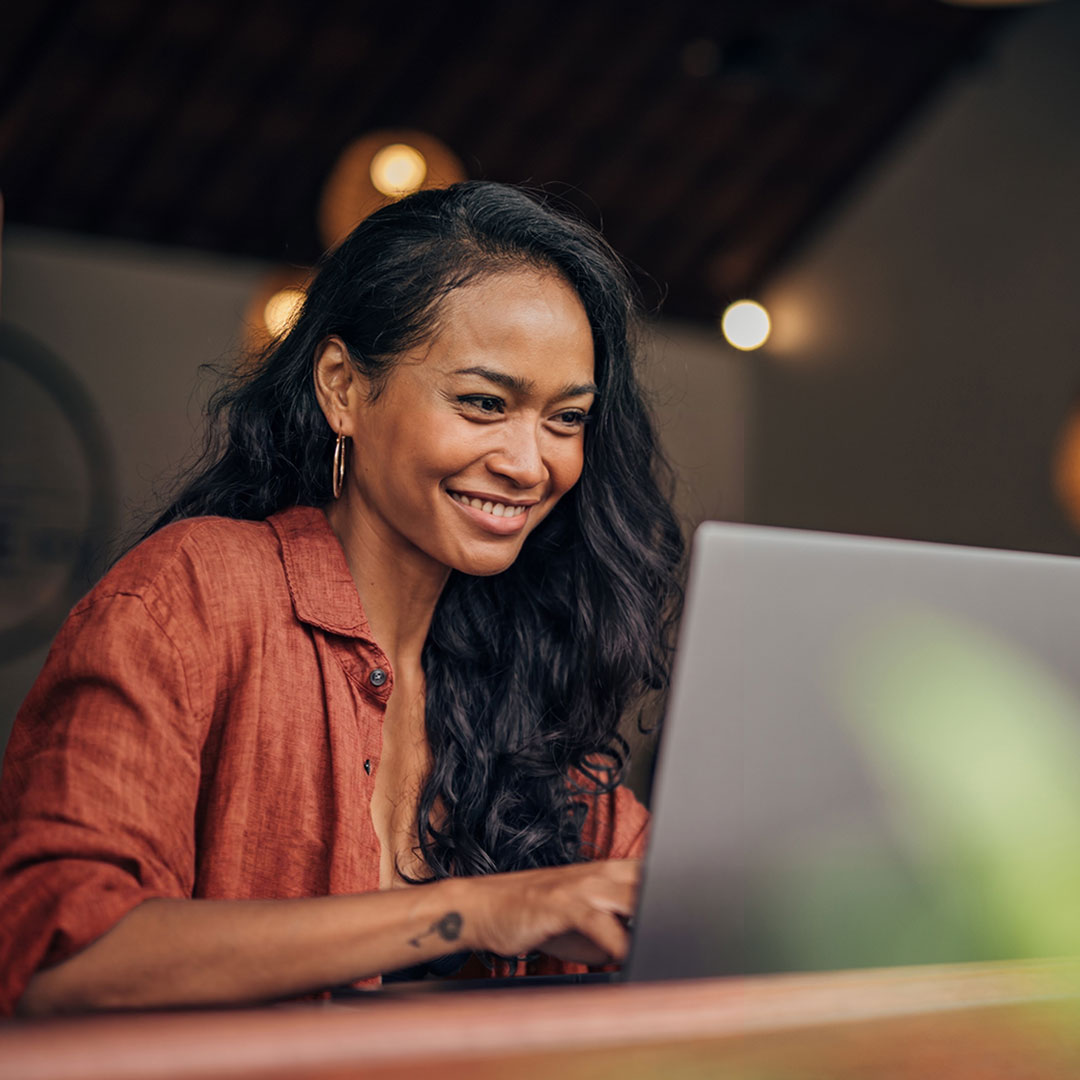 Woman at computer reading 