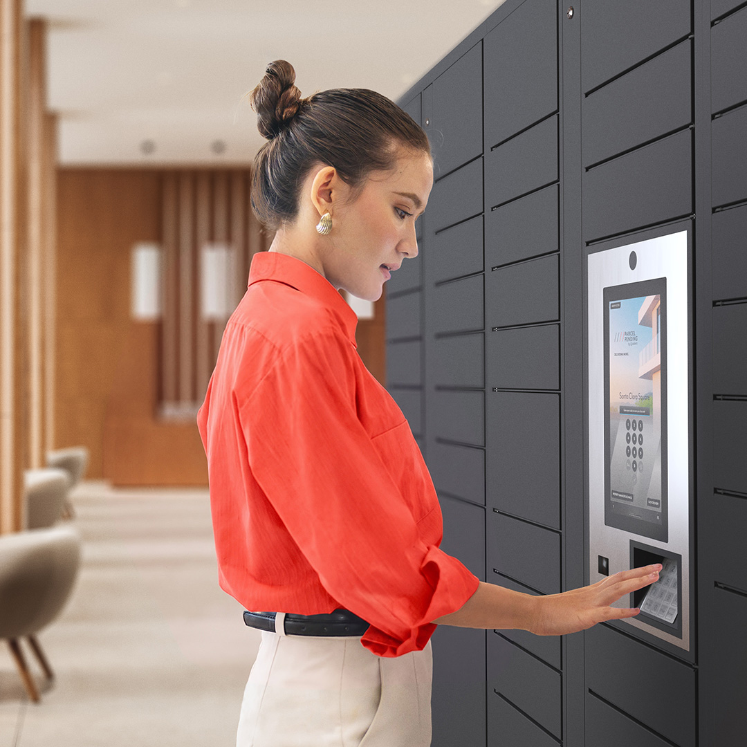 Woman at premier parcel locker using touch screen
