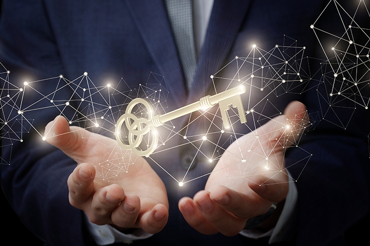Businessman showing the hands with the key to success