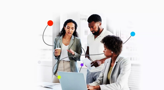 group of people around a laptop