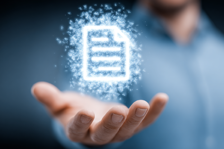 Hand held out with a glowing digital invoice icon hovering above it, representing electronic invoicing and automated billing.