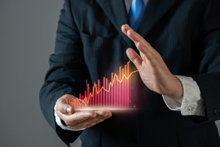Man hand stopping growth on chart