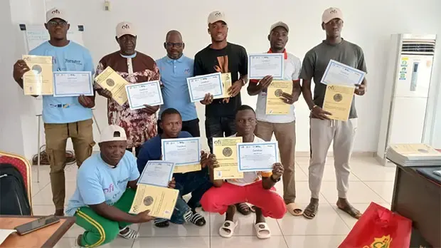Group of people showing certificates