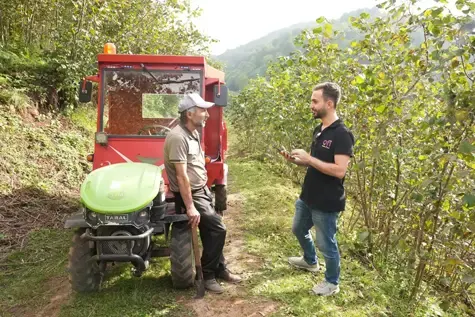 ofi worker talking with a farmer