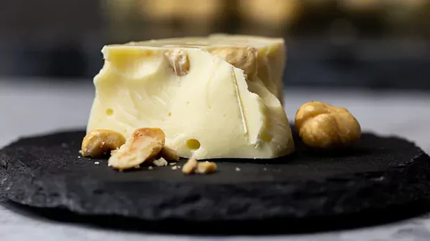 Close up photo of white chocolate with hazelnuts